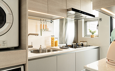 An elegant and practical kitchen with soft-toned surfaces and premium appliances